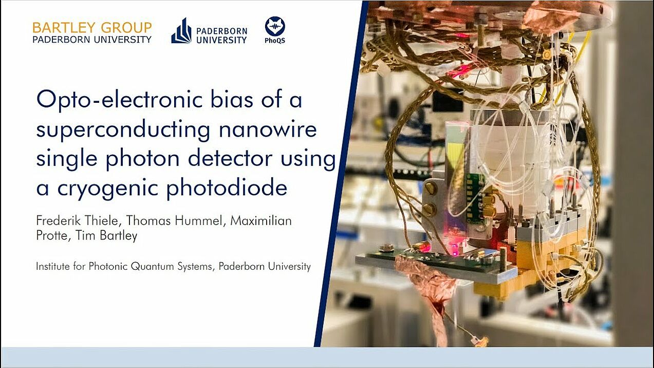 Opto-electronic bias of a superconducting nanowire single photon detector using cryogenic photodiode